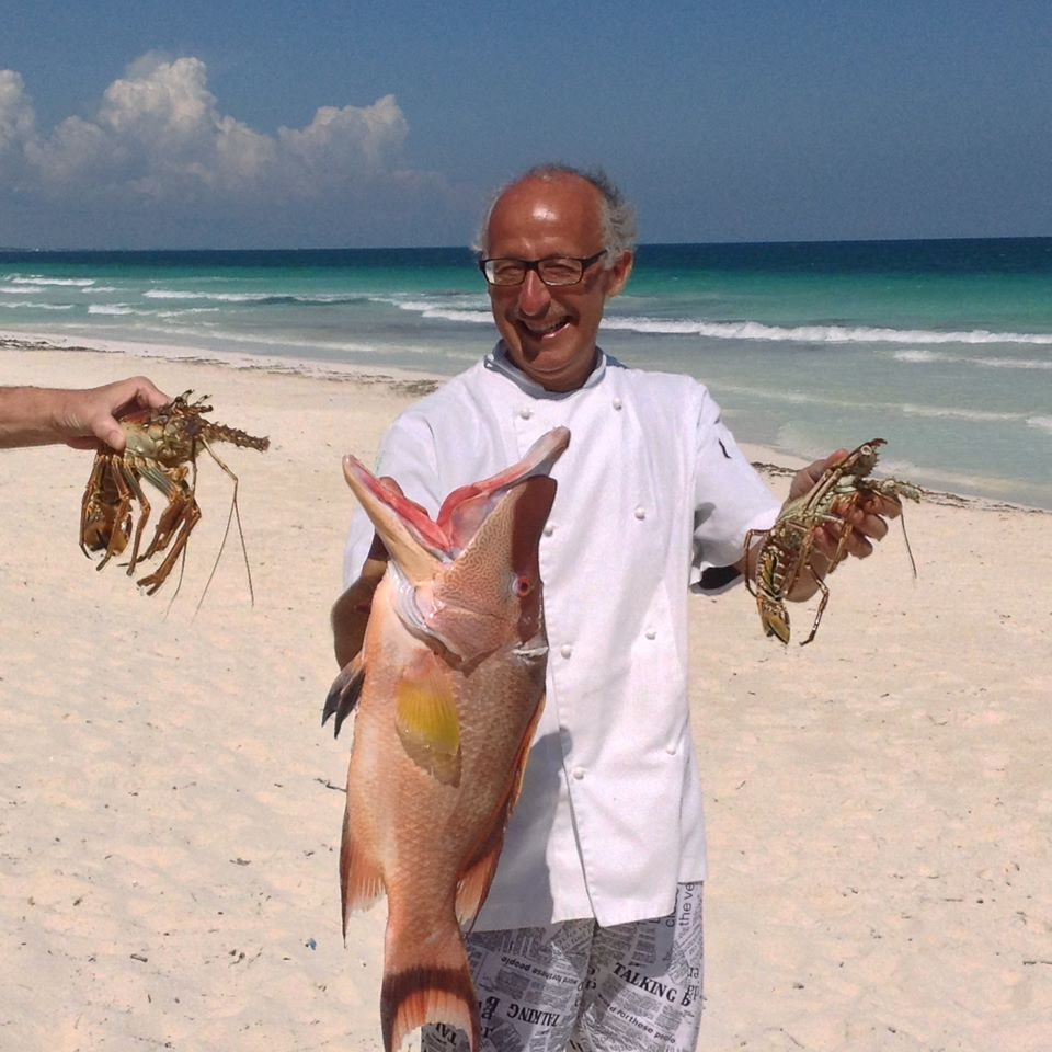 Chef Pino with fresh Caribbean seafood in Mexico