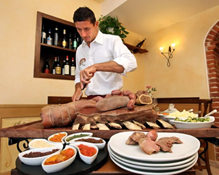 Chef preparing Bollito Misto